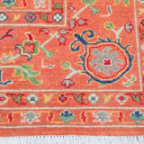 Border and edge detail of orange & blue Kazak-inspired wool rug 29636.