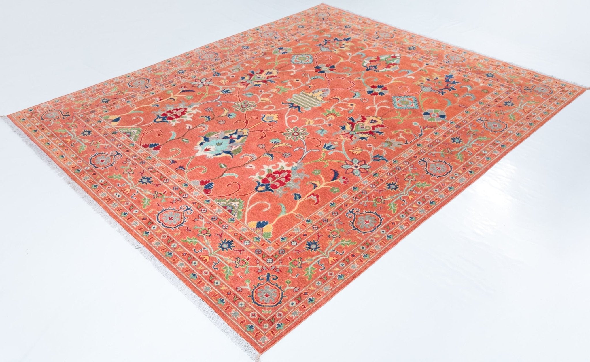 Full view at an angle of orange & blue Kazak-inspired wool rug 29636.