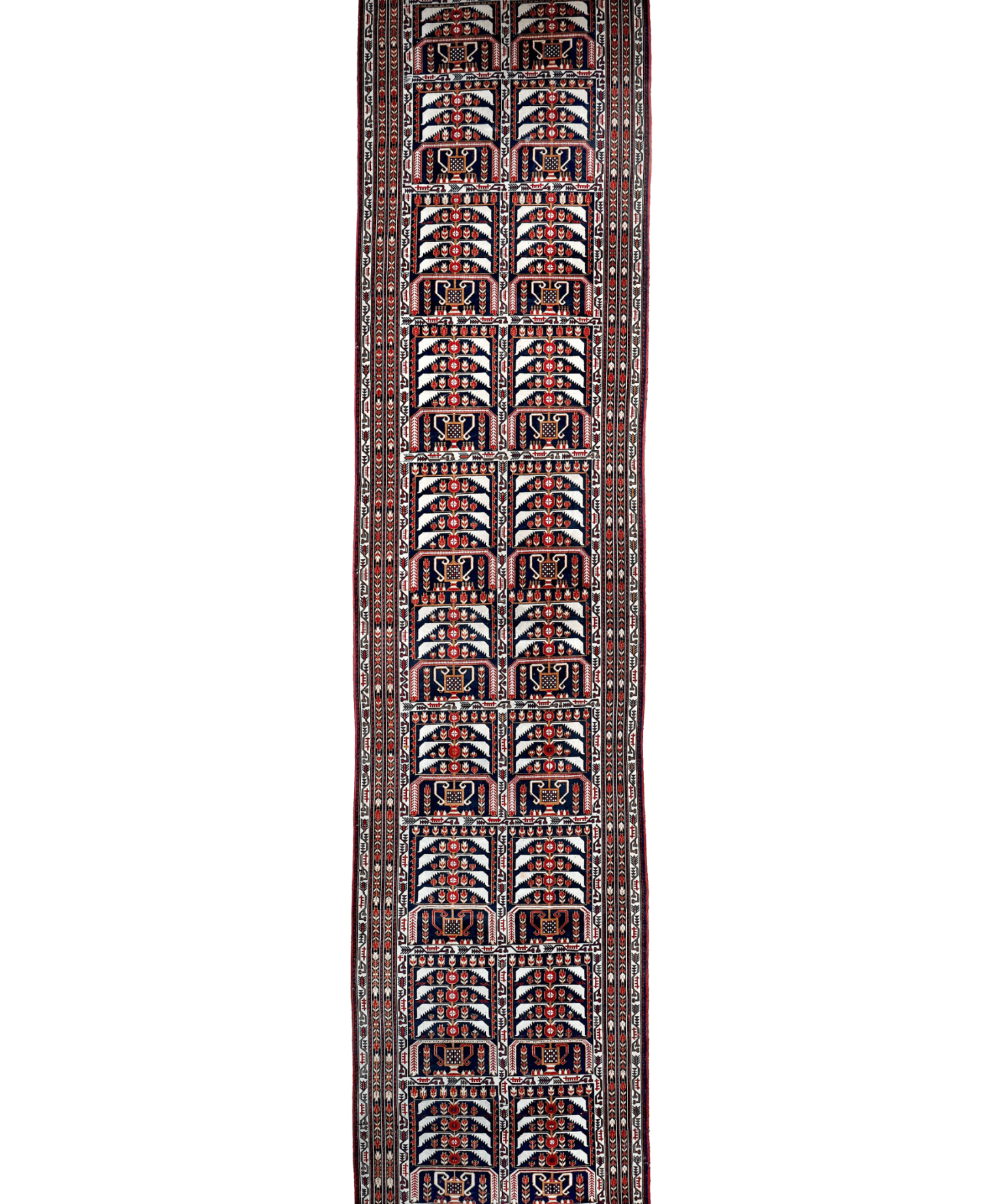 Navy runner rug with repeating red and beige geometric medallions