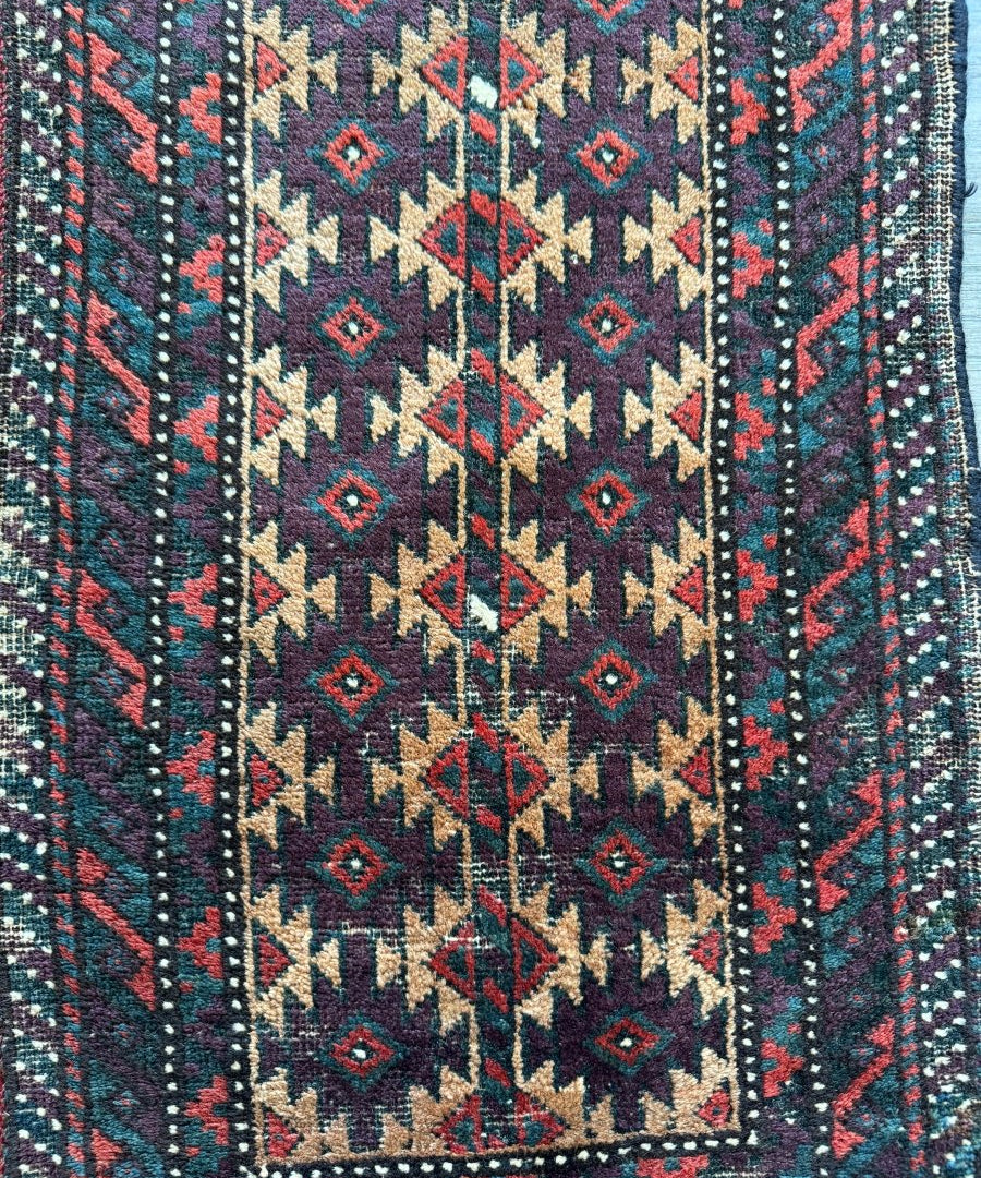 Baluch bag face rug panel with centered diamonds and dotted teal red border