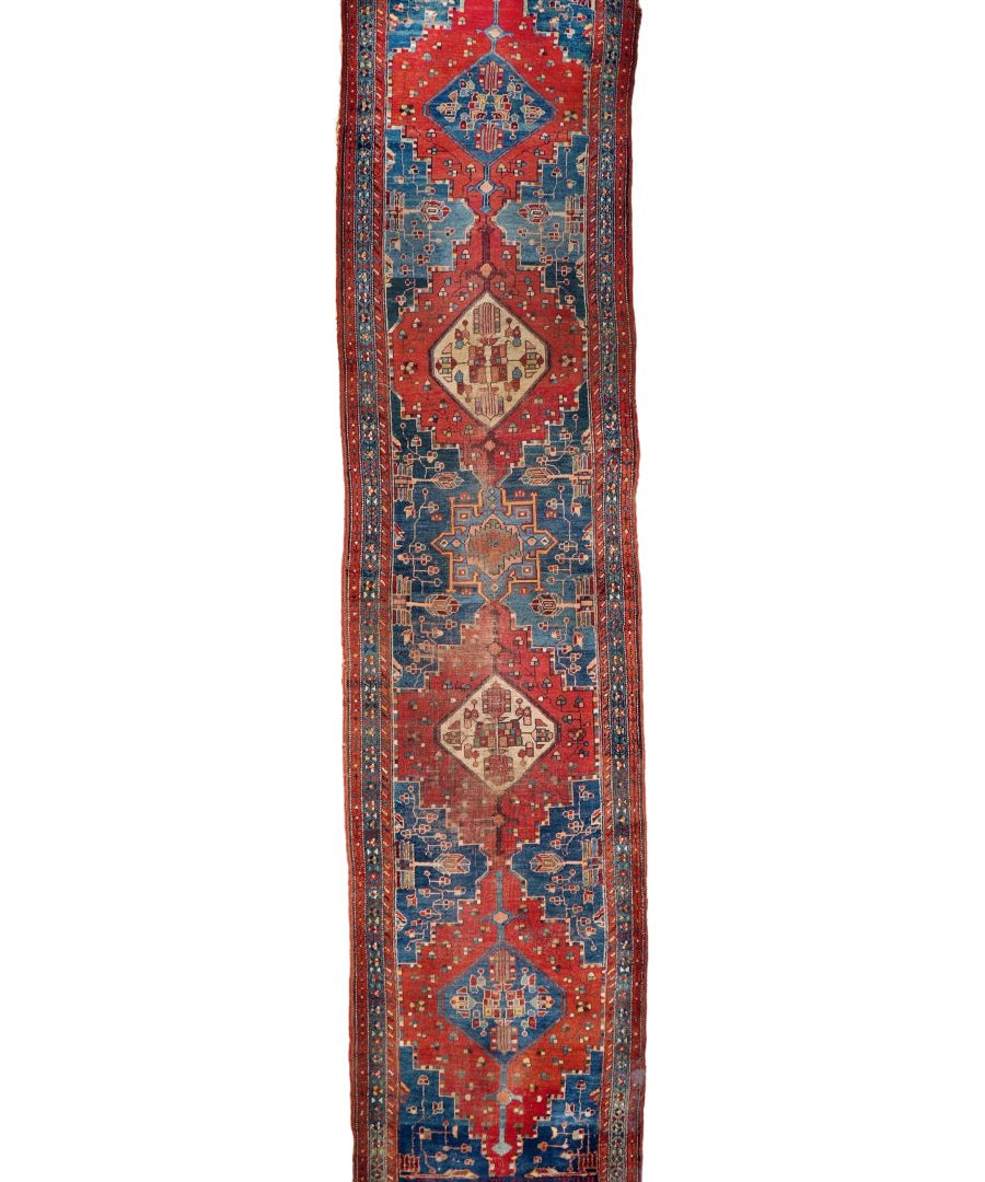 Antique Bidjar runner rug standing view with red and blue geometric pattern