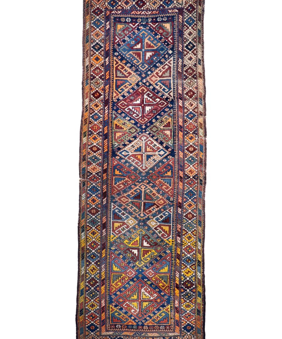 Antique tribal runner rug rectangle with rust, blue, and beige geometric diamond pattern
