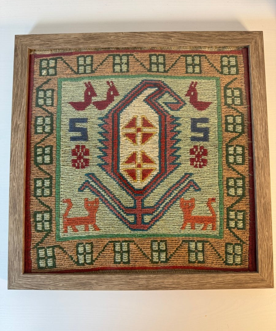 Framed Azerbaijan kilim rug, cream center medallion with red, blue, and green pattern