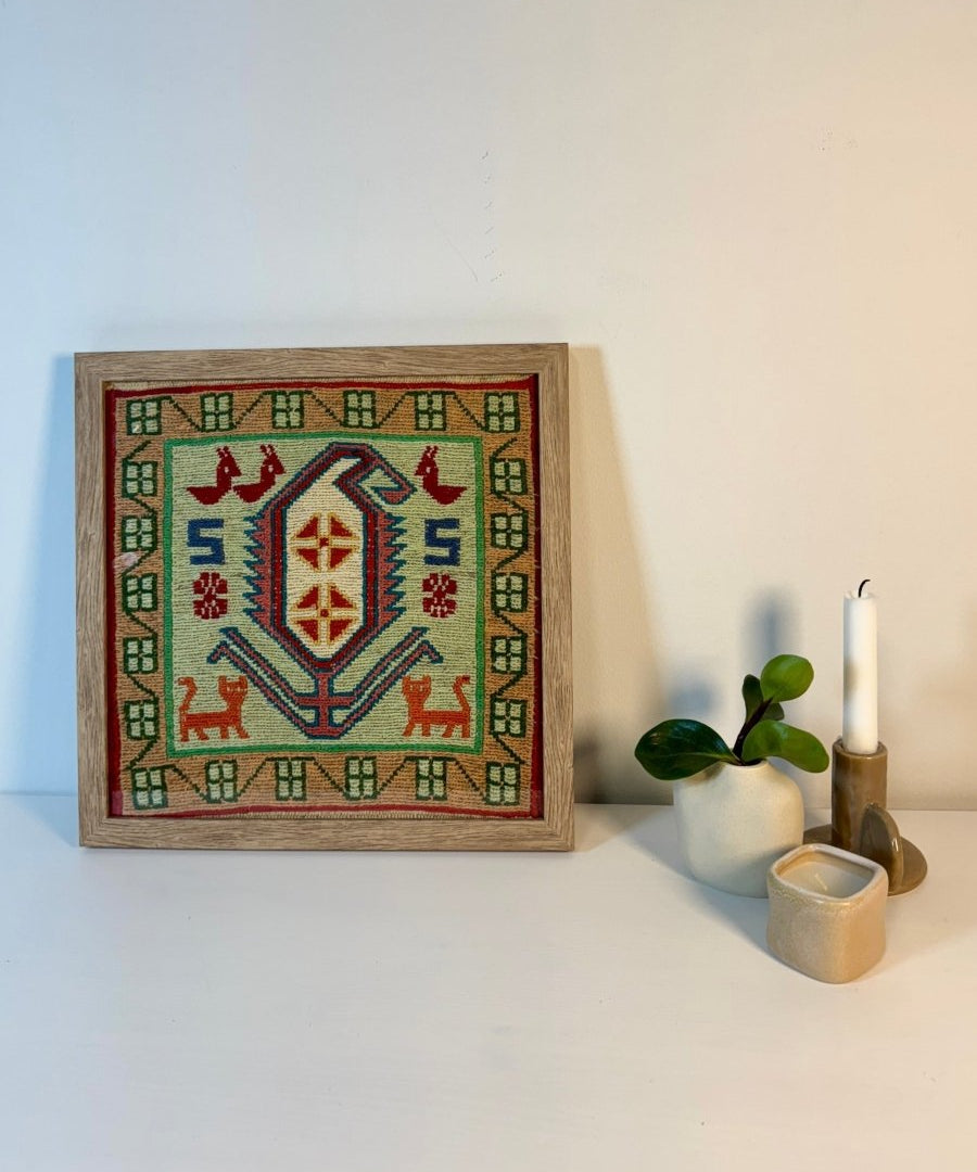 Framed Azerbaijan kilim rug, green and beige with red geometric border and animals