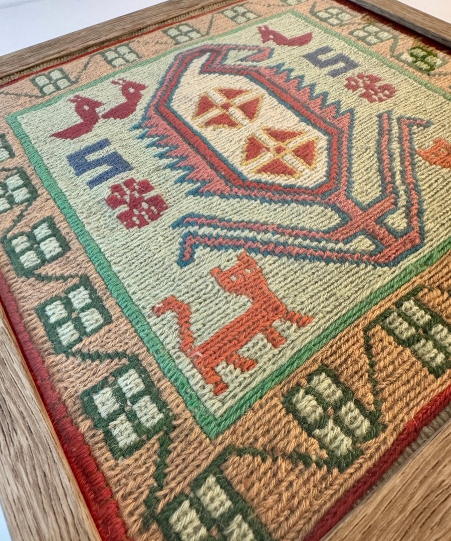 Framed kilim rug detail, mint green field with central red, blue and beige diamond motif