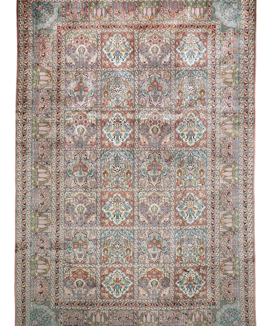 Front view of Kashmir-style rug with teal, blue, cream, and rust medallion grid pattern.