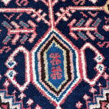 Persian Abadeh rug with navy field and pink-blue geometric medallion motif