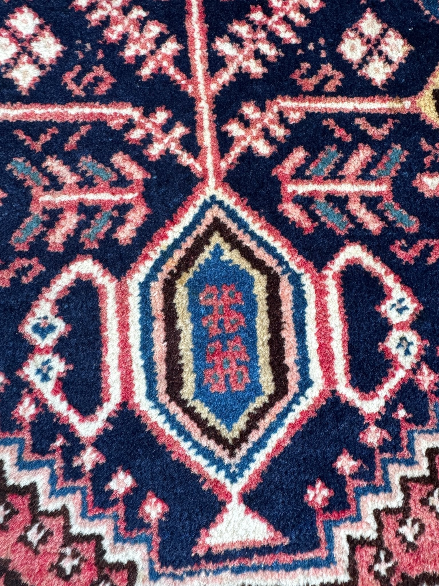 Persian Abadeh rug with navy field and pink-blue geometric medallion motif