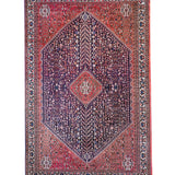 Full view Persian-style rug with red border, navy center, and diamond medallion