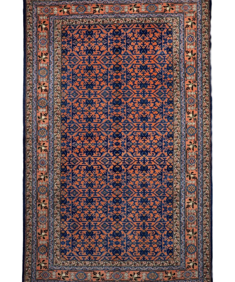 Persian Ardabil rug with navy-blue geometric design, rust border, and cream inner frame