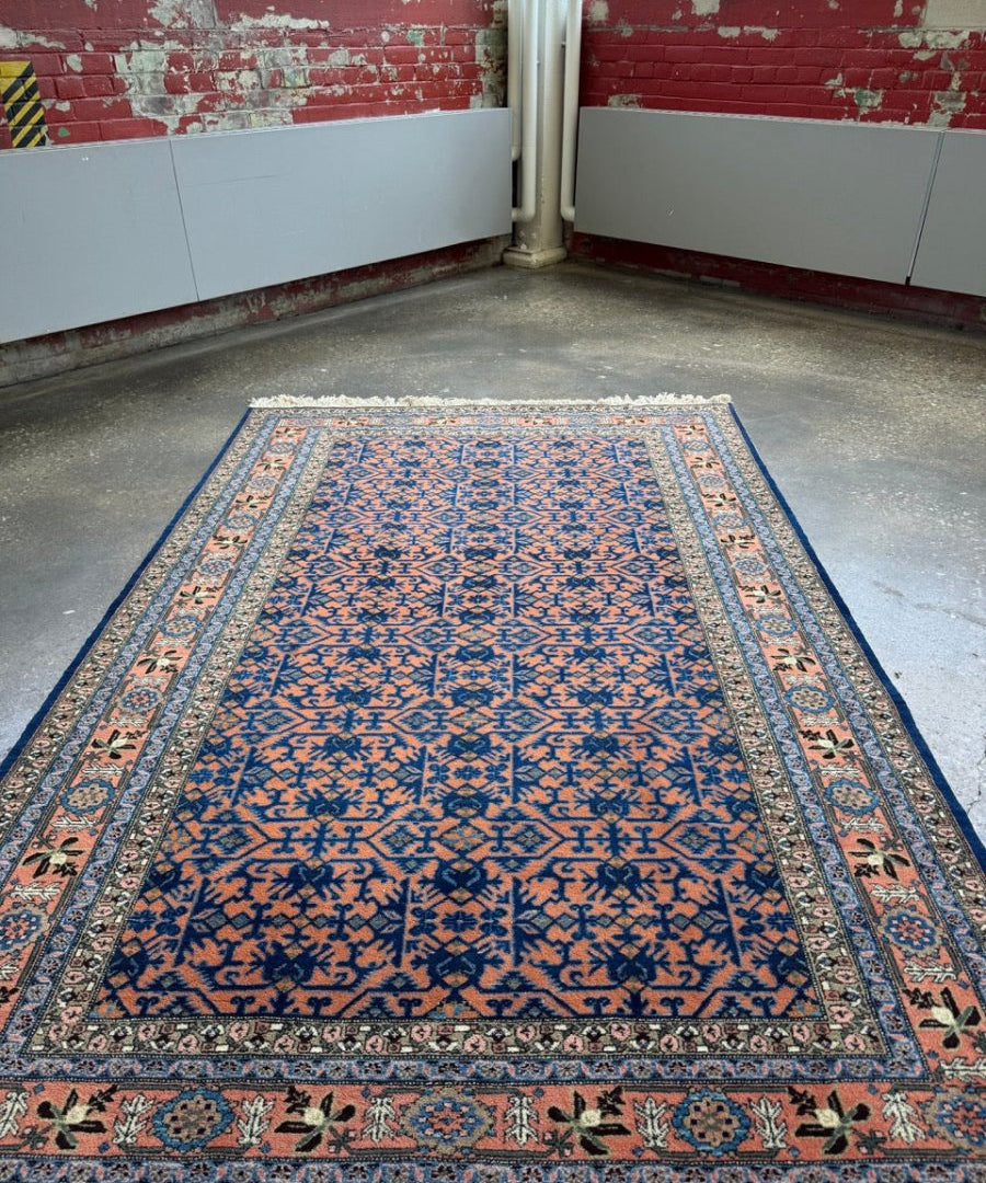 Persian Ardabil rug with blue ground, orange highlights, ornate cream border and fringe