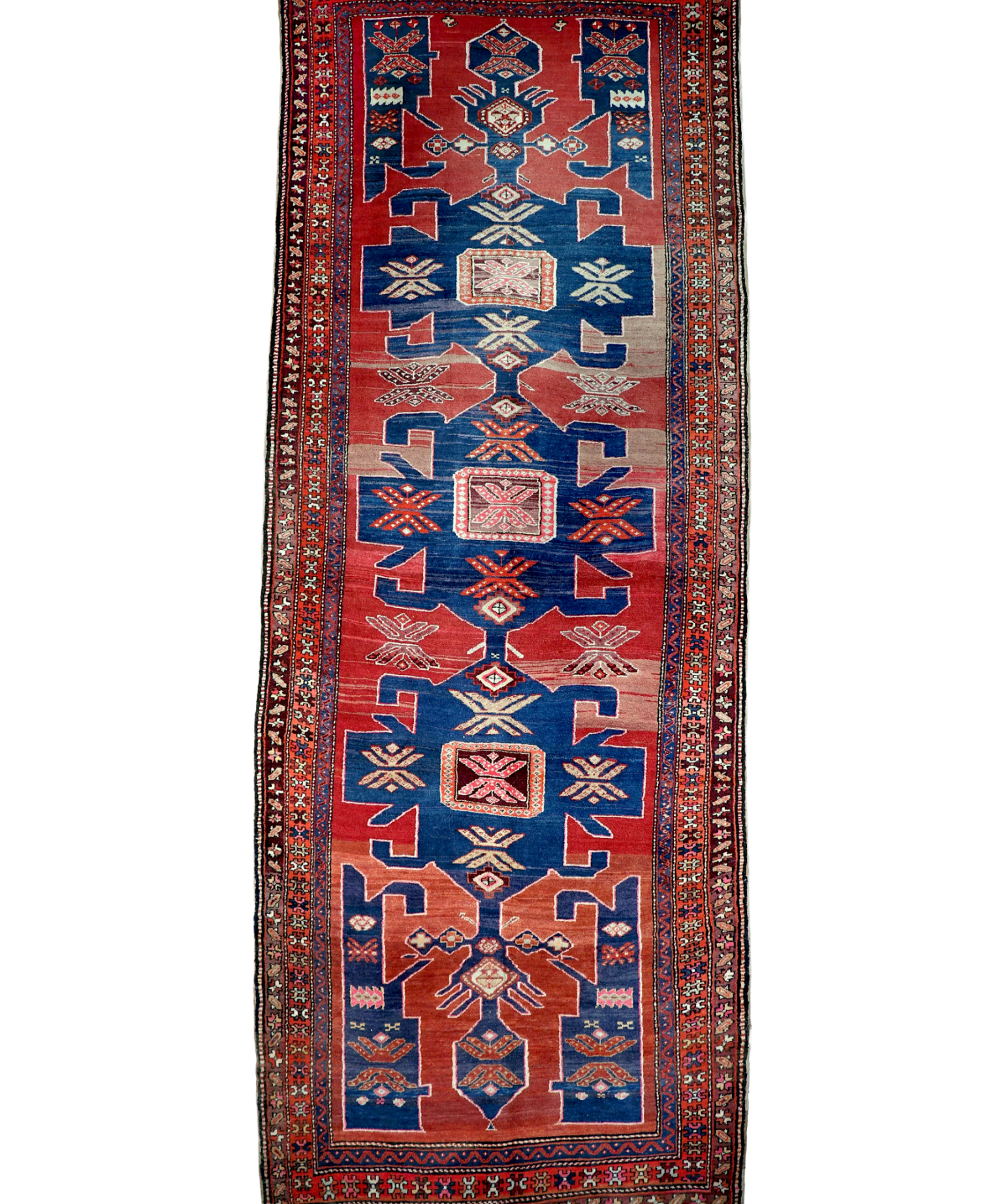 Persian Arshaq meshkin rug centered view with red border, blue field, and fringe