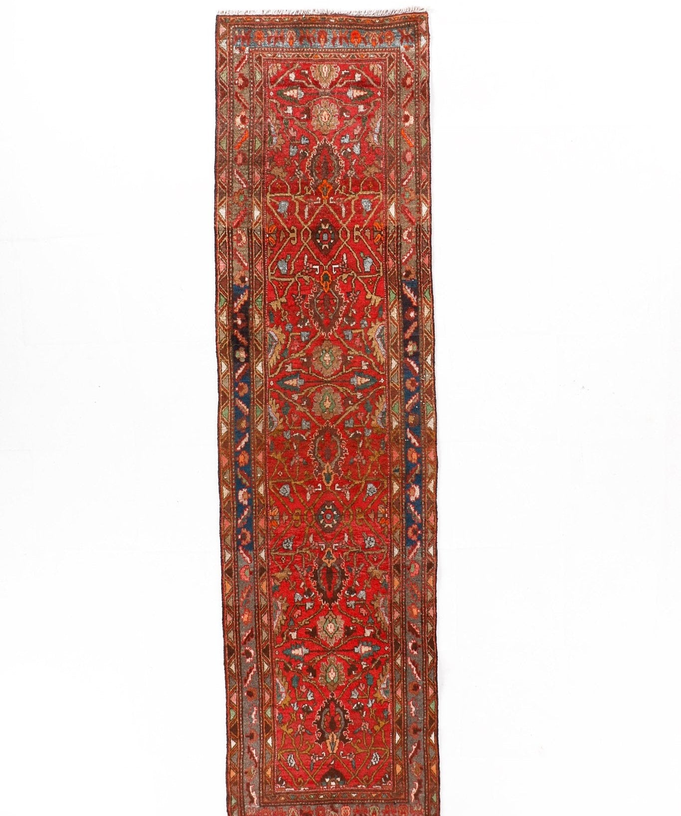 Red and navy Persian runner rug with central medallion and ornate border