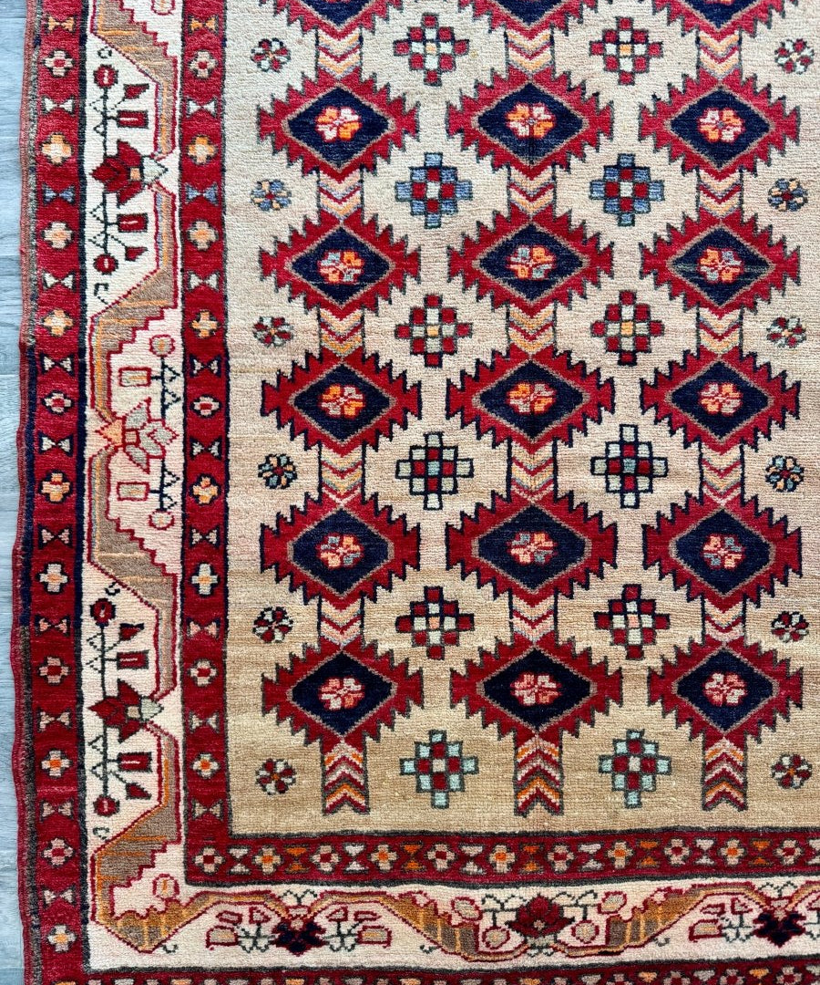 Persian Azerbaijan runner rug with cream field and navy geometric medallions on red