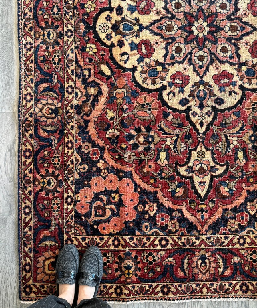 Persian Bakhtiar rug with navy, red, and cream floral medallion pattern and border