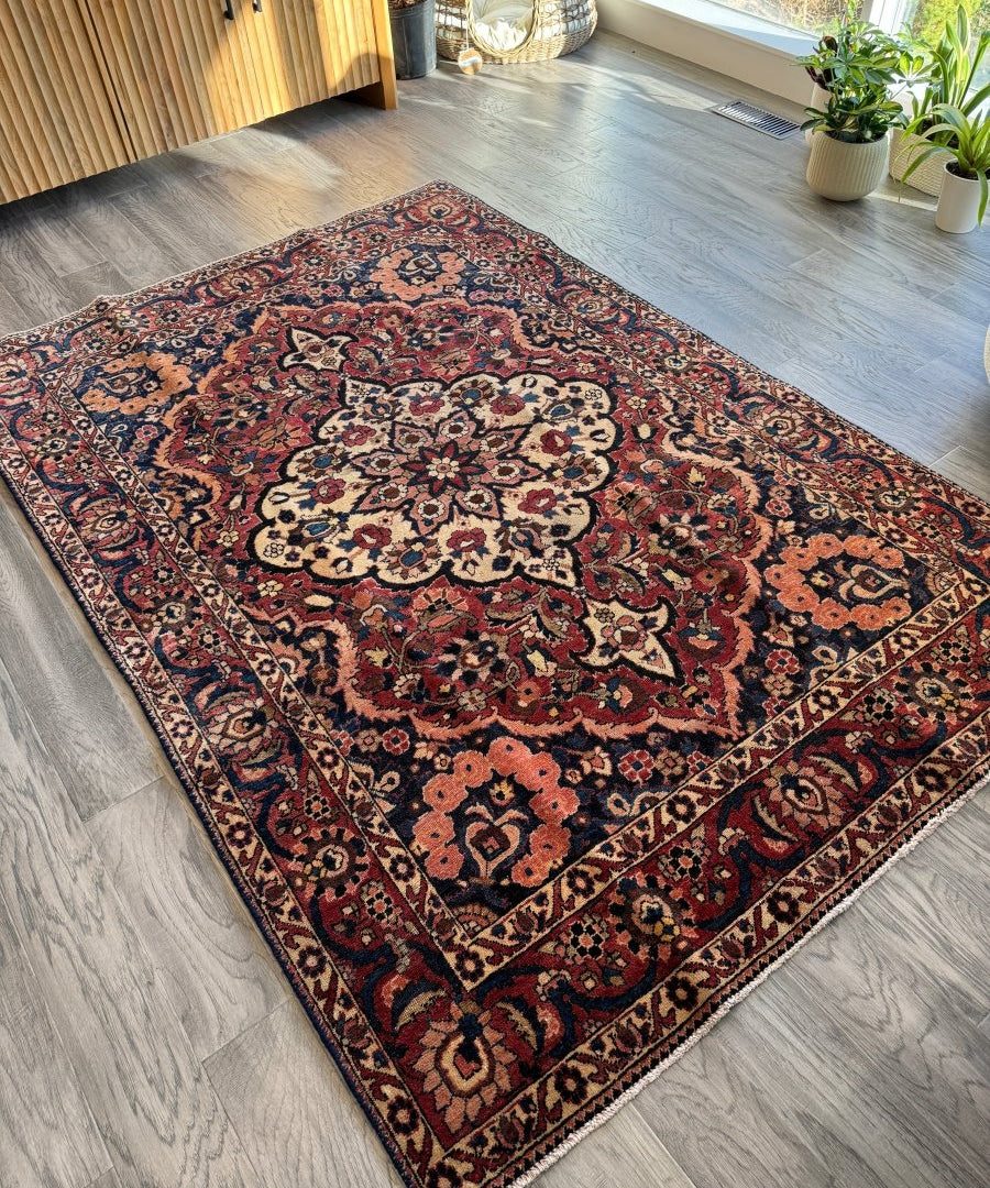 Persian Bakhtiar area rug with red, navy, and cream floral medallions and geometric border