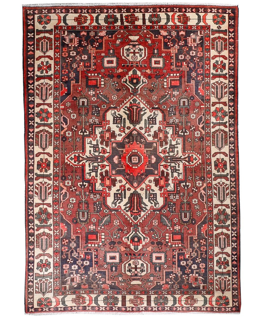 Persian Bakhtiar rug full view with red field, cream border, and ornate geometric center