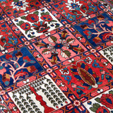 Persian Bakhtiari rug top view with red-blue lattice blocks and ivory accent medallions