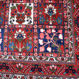 Persian Bakhtiari rug border section with red and blue tiles plus floral center motifs