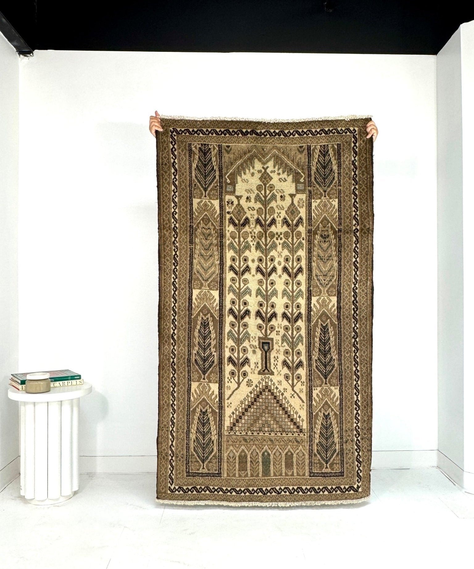 Persian Baluch rug with beige center and brown geometric border, rectangular design