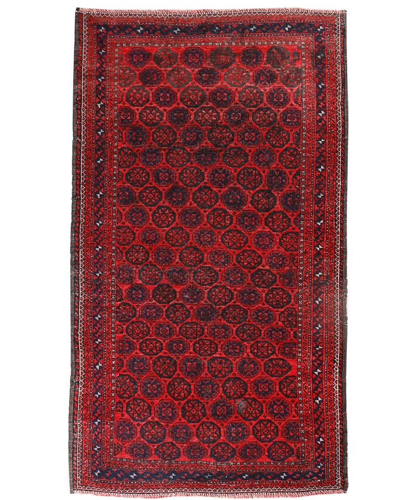Persian Baluch rug with red field and black geometric medallion pattern, border trim