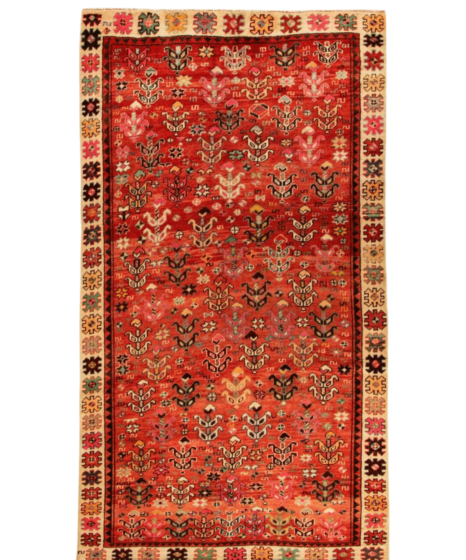 Red patterned rug with decorative border and dense ornamental medallions