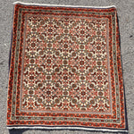 Small Persian Bidjar rug square with cream center, red border, and ornate medallion pattern.