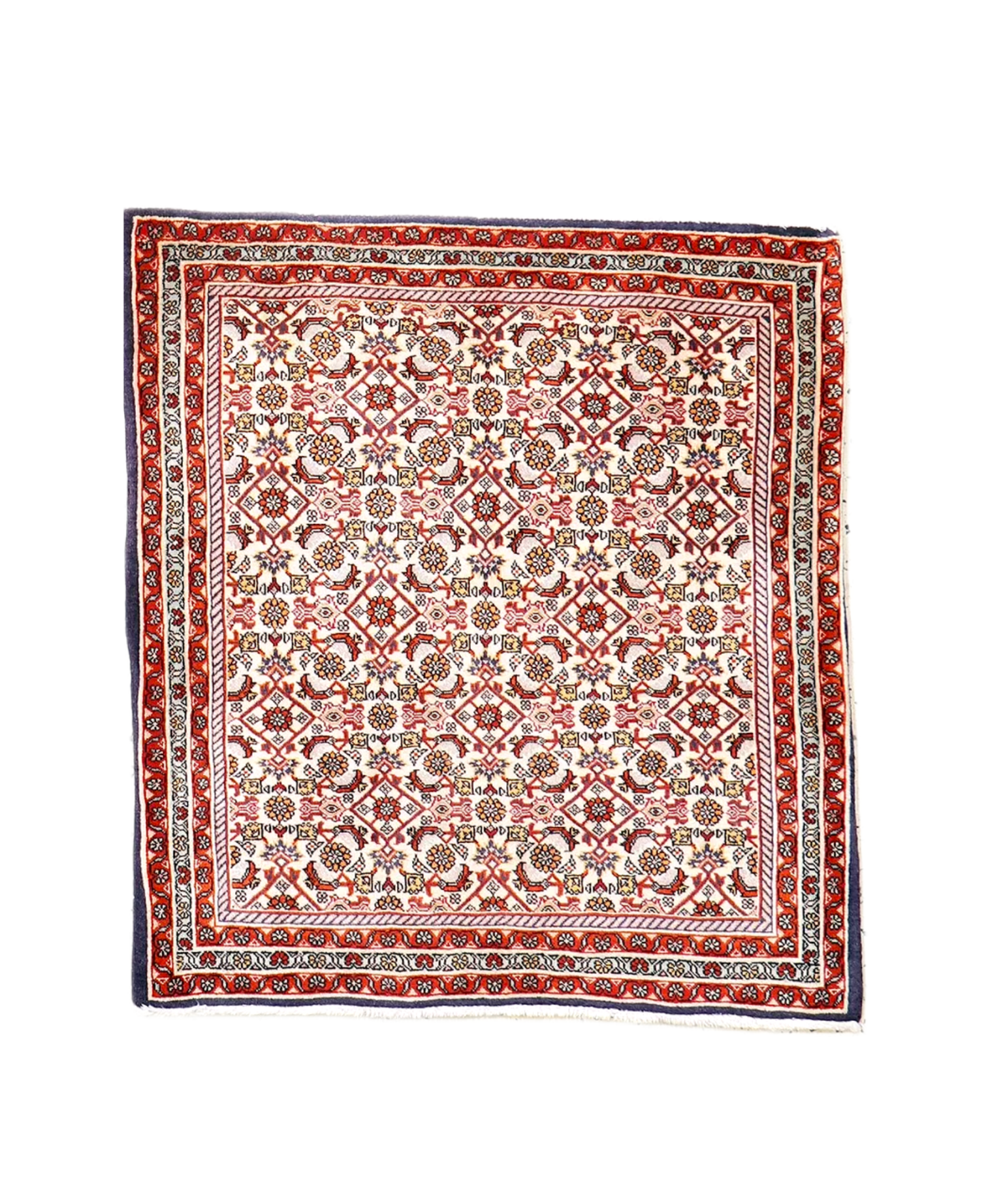 Persian Bidjar rug with cream field, red border, and multicolor geometric medallions.