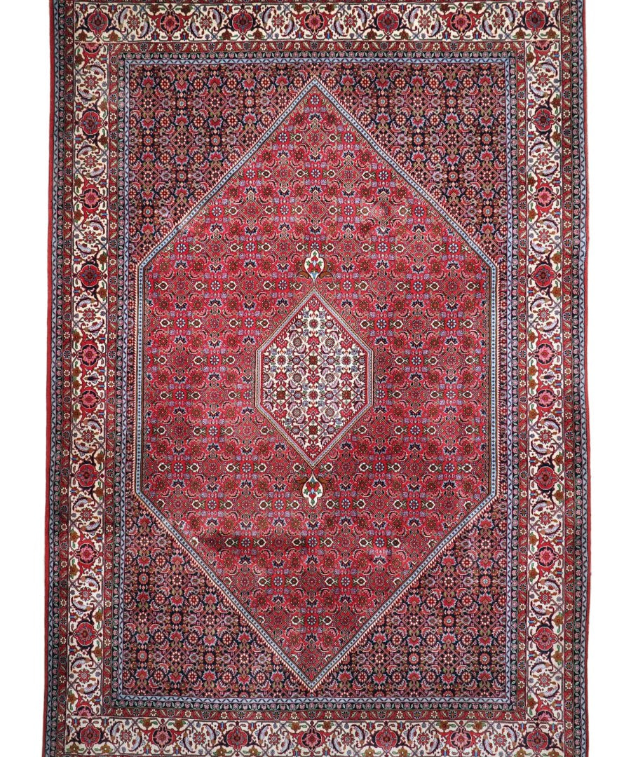 Persian Bidjar rug with red field, navy border, and central diamond medallion