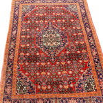 Persian Bijar rug with red center, navy corner accents, and blue border stripes