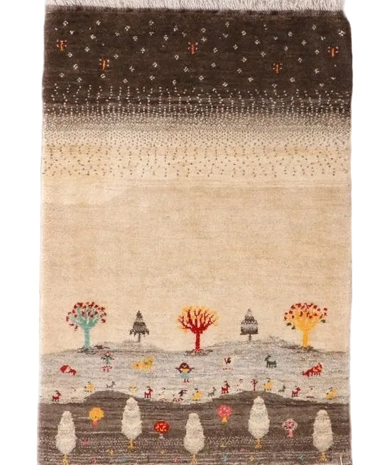Gabbeh rug with dark top, beige middle, and colorful tree, animal, and house-like motifs