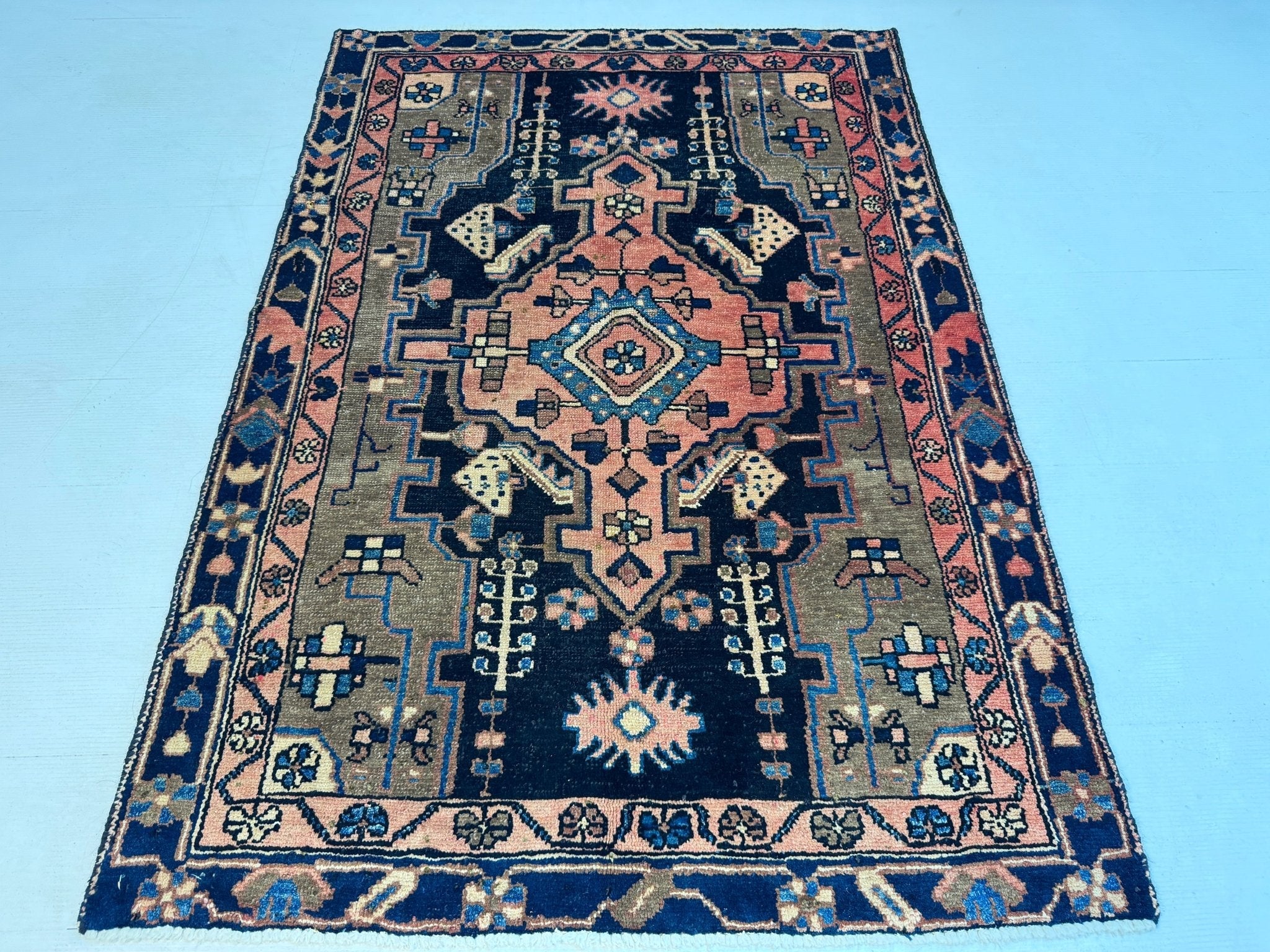 Hamadan rug with navy, rust, and blue geometric medallion center