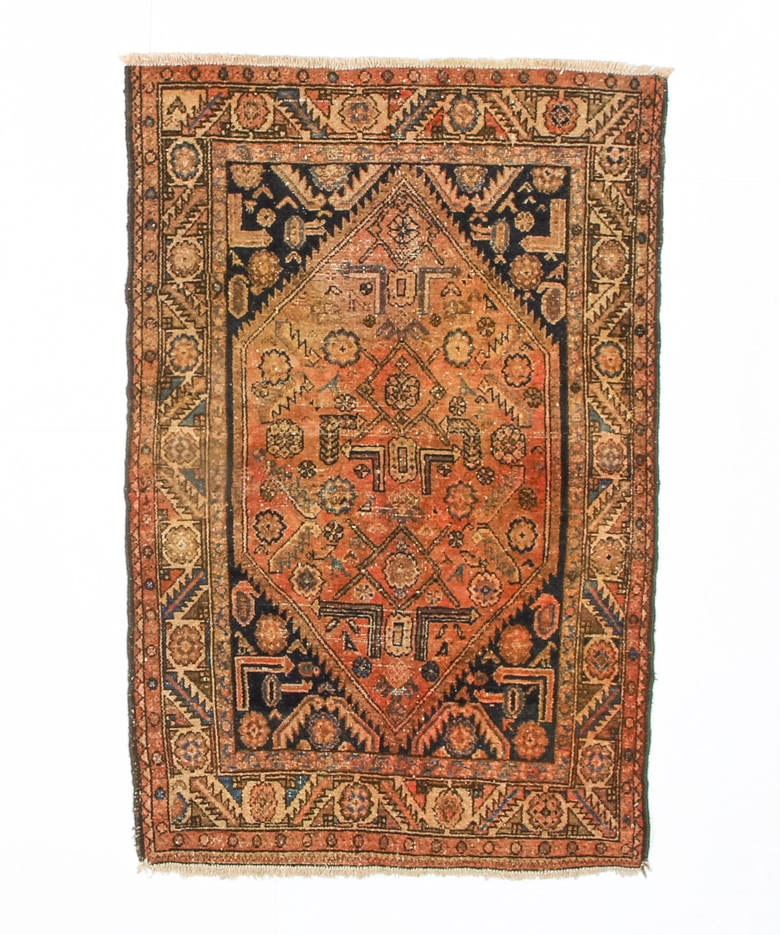 Persian Hamadan rug with rust orange field, navy geometric medallion, fringed edges