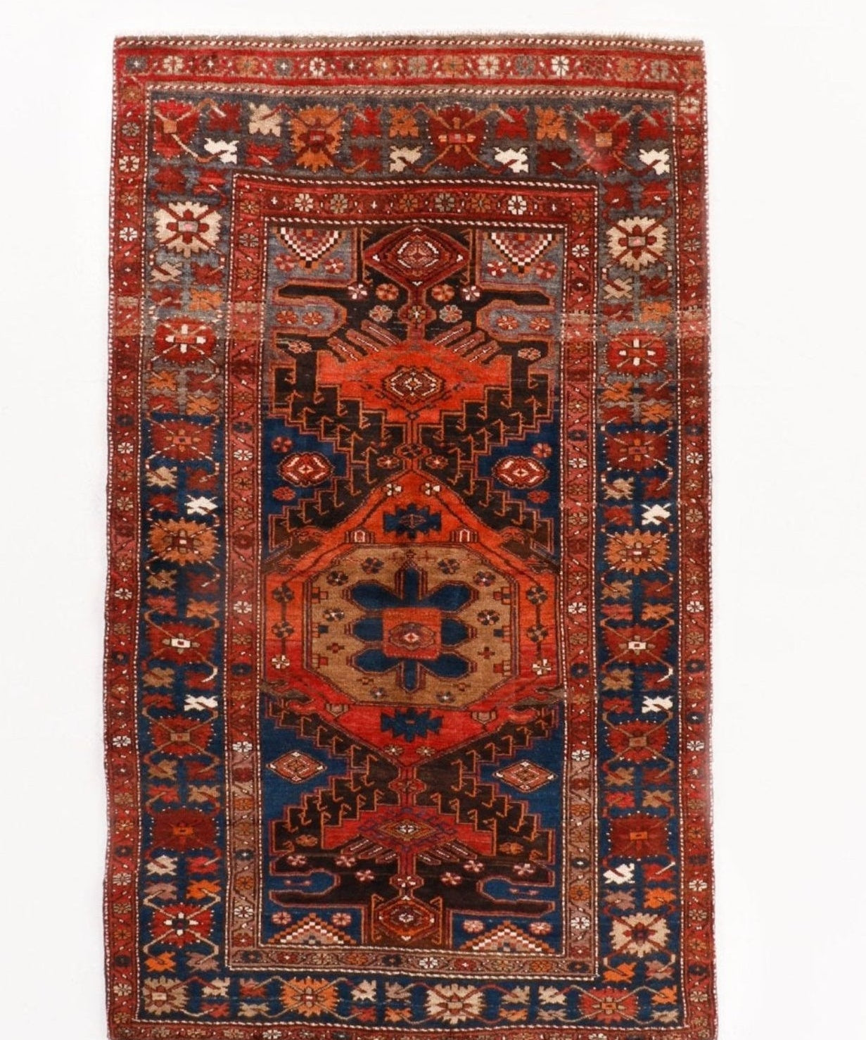 Persian Qoltuq area rug with red and navy geometric medallion border