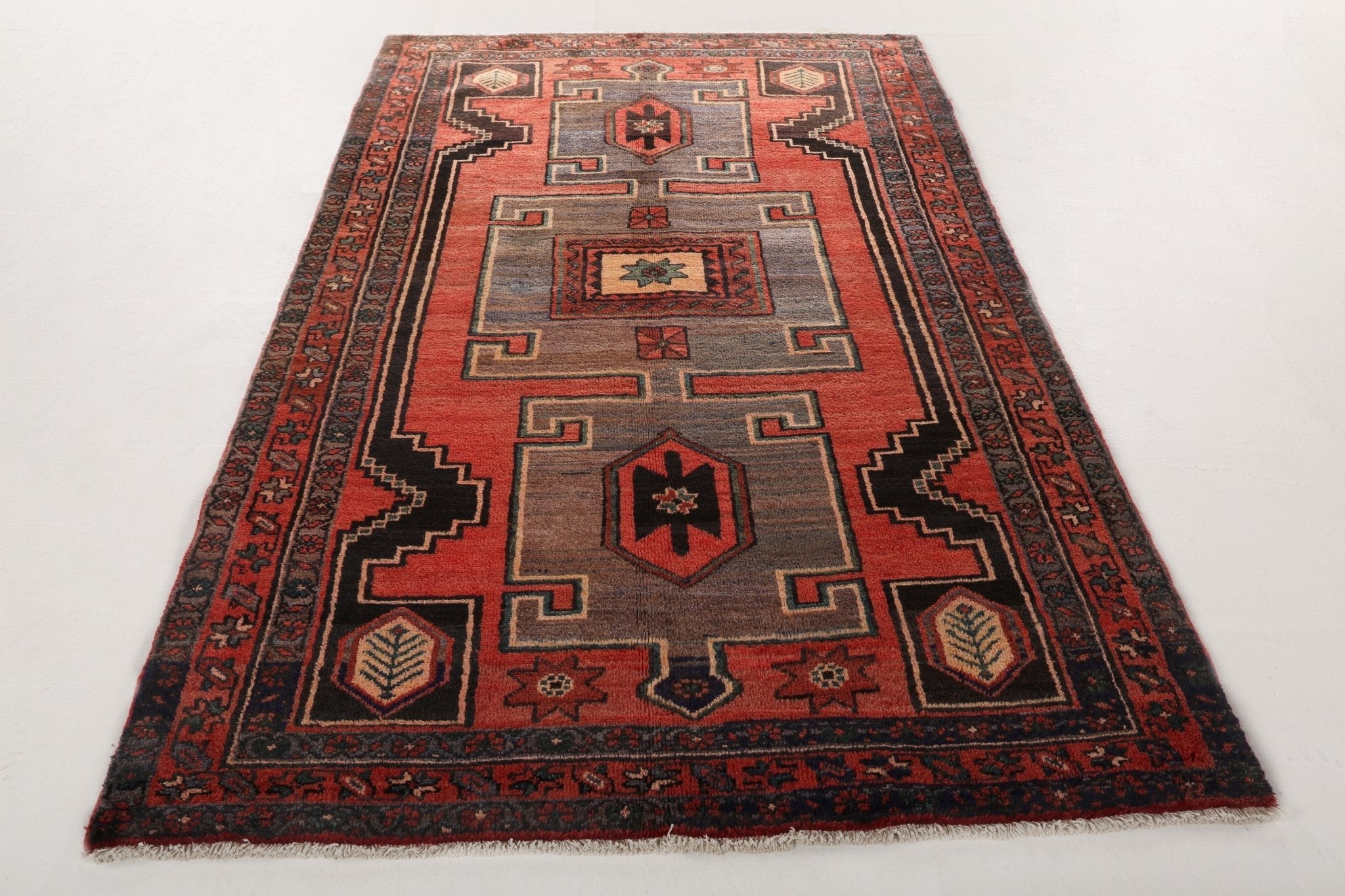 Persian Hamadan rug with central panel and red, gray, black stepped motifs