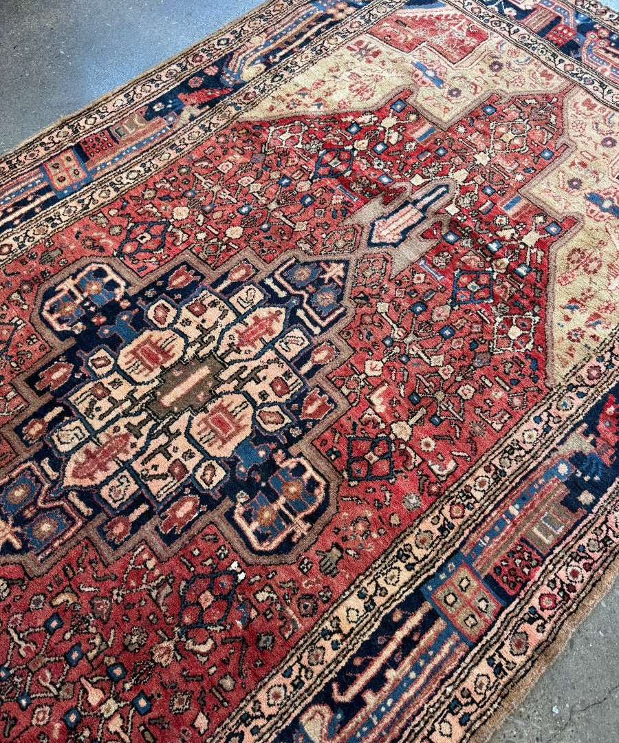 Hamadan rug close-up: red field with cream detailing and dark navy corner motifs
