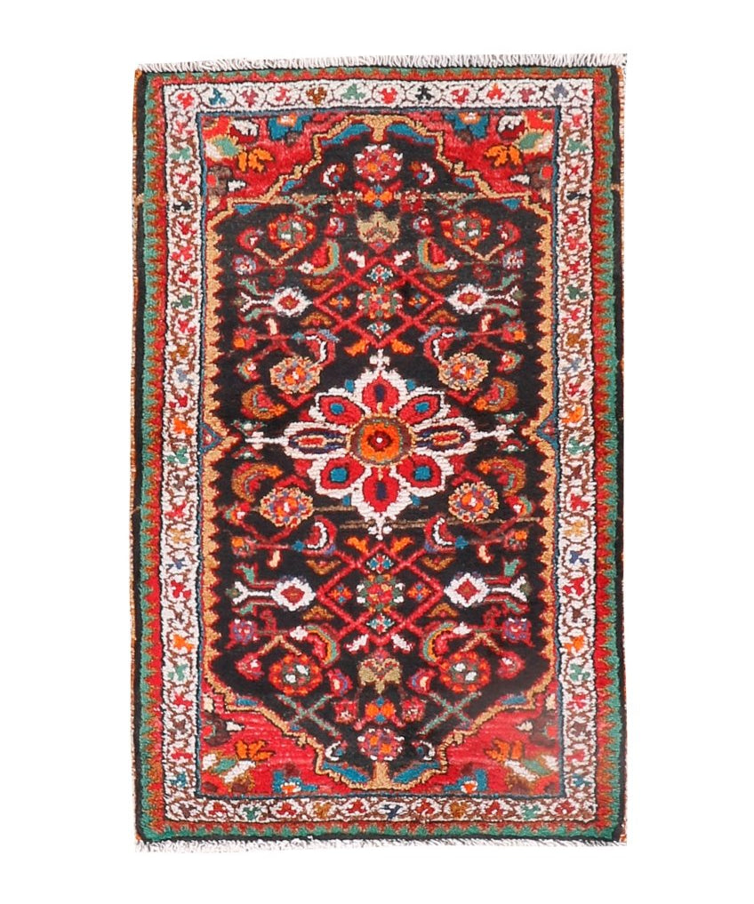 Persian Hamedan rug with red field, navy medallion pattern, bordered edges