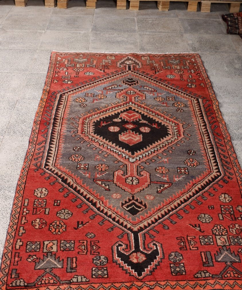Persian Zanjan rug in red and gray with black center diamond and geometric motifs