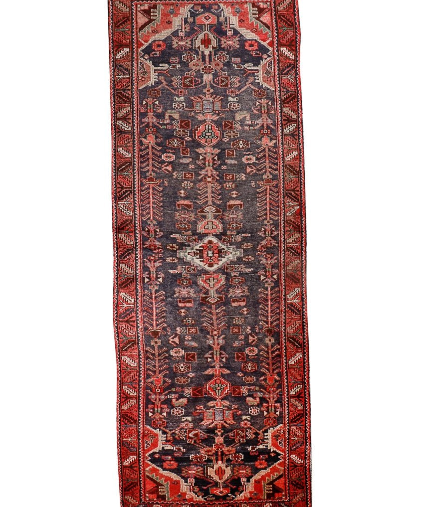 Persian Hamadan runner rug with dark navy field, red border, and geometric medallion pattern