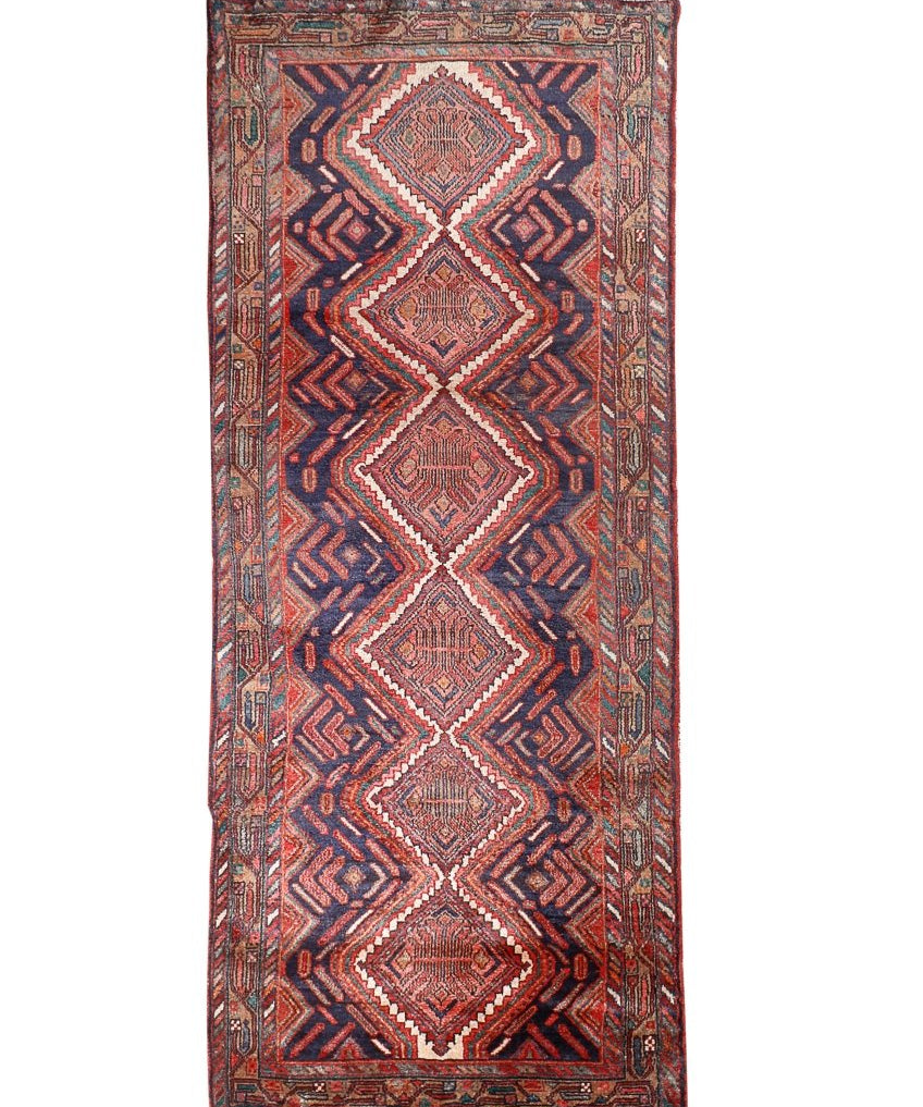 Persian Hamadan runner rug with navy background, rust and cream diamond medallions