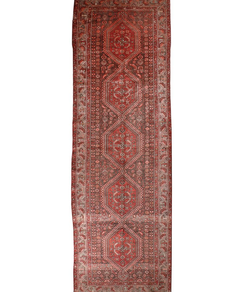 Persian Hamedan runner rug with red field, central medallions, and ornate geometric border.