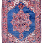 Persian Heriz rug, red and blue with central medallion, ornate geometric border.