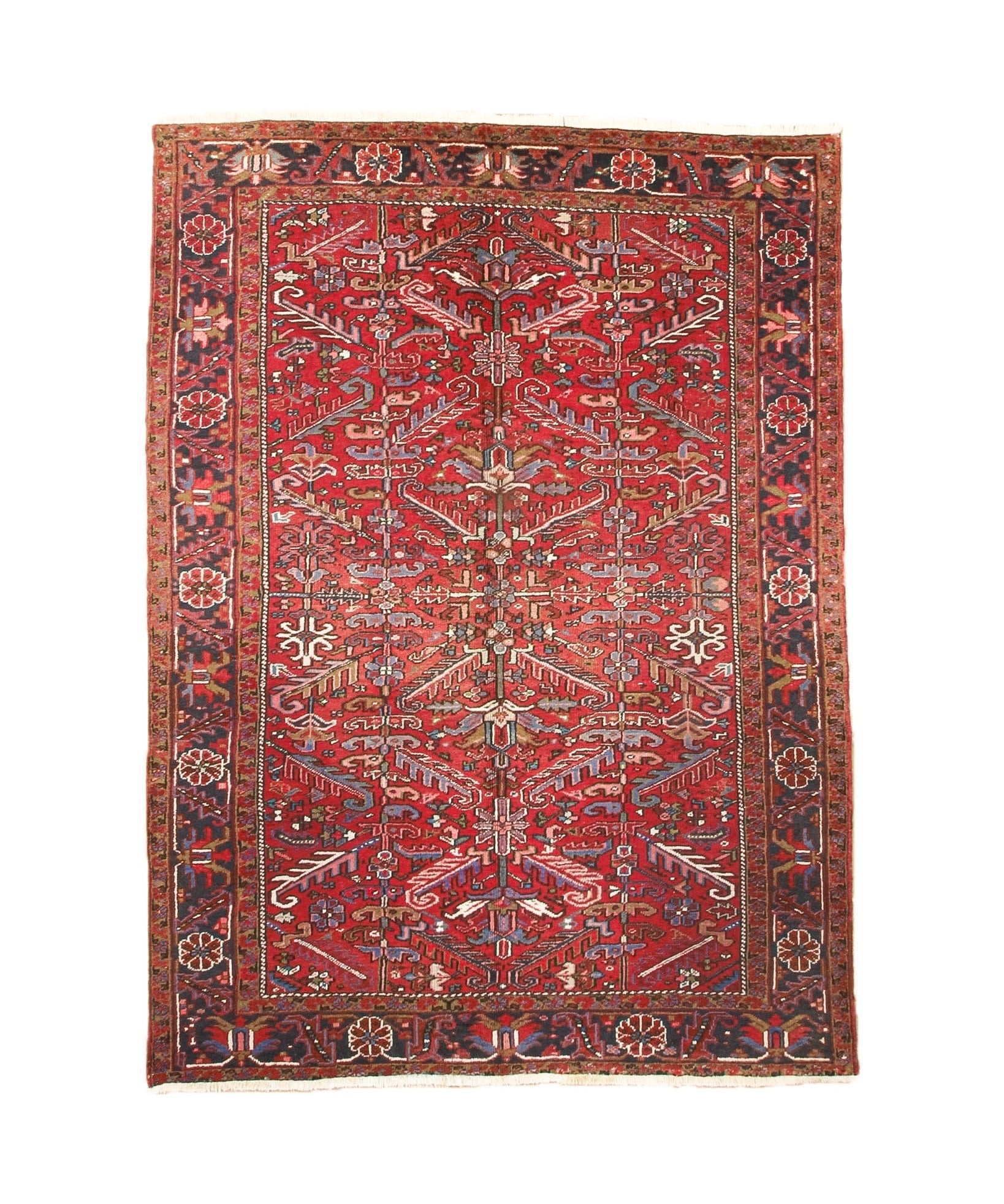 Red Persian-style Heriz rug with central medallion, ornate border, and cream accents