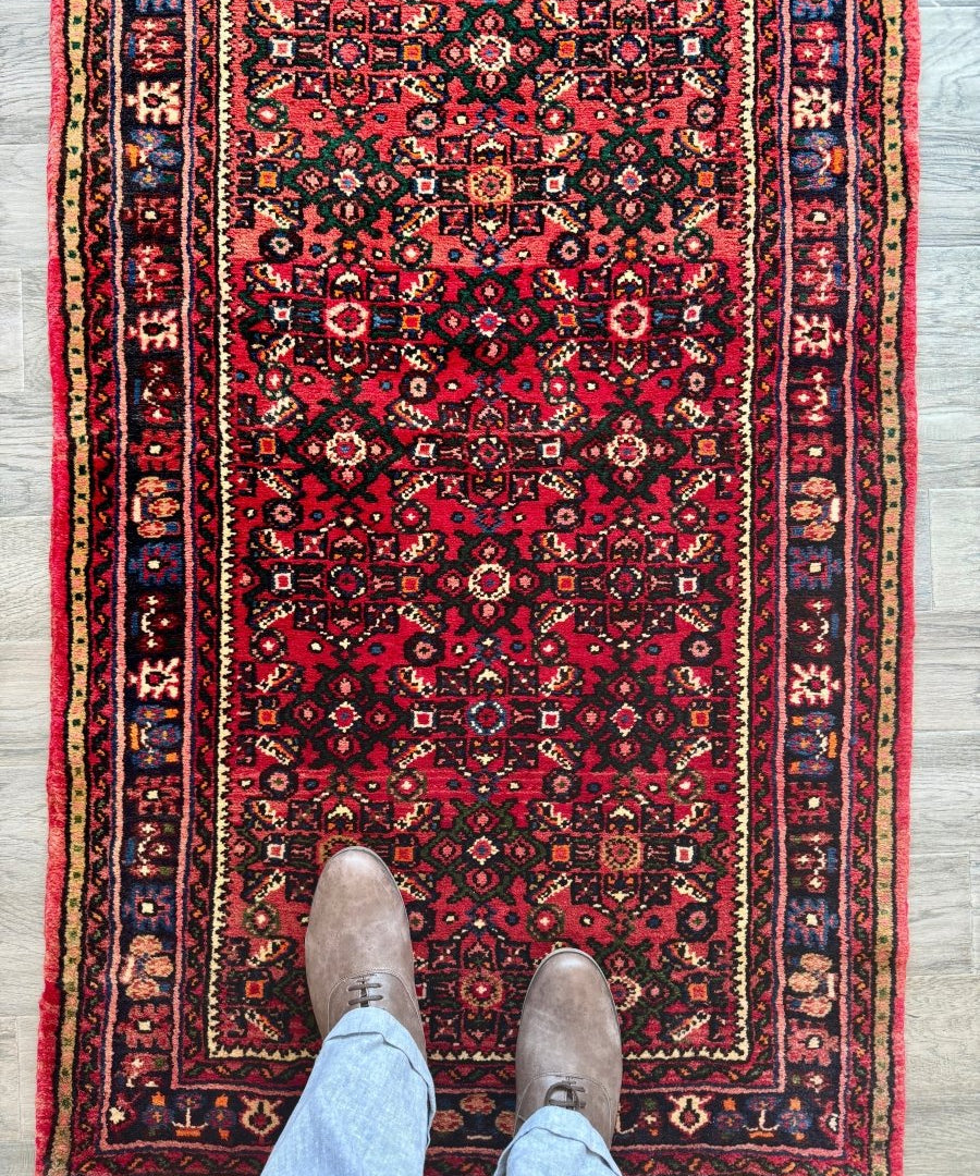 Hossein Abad Persian runner rug with red field and ornate geometric medallions