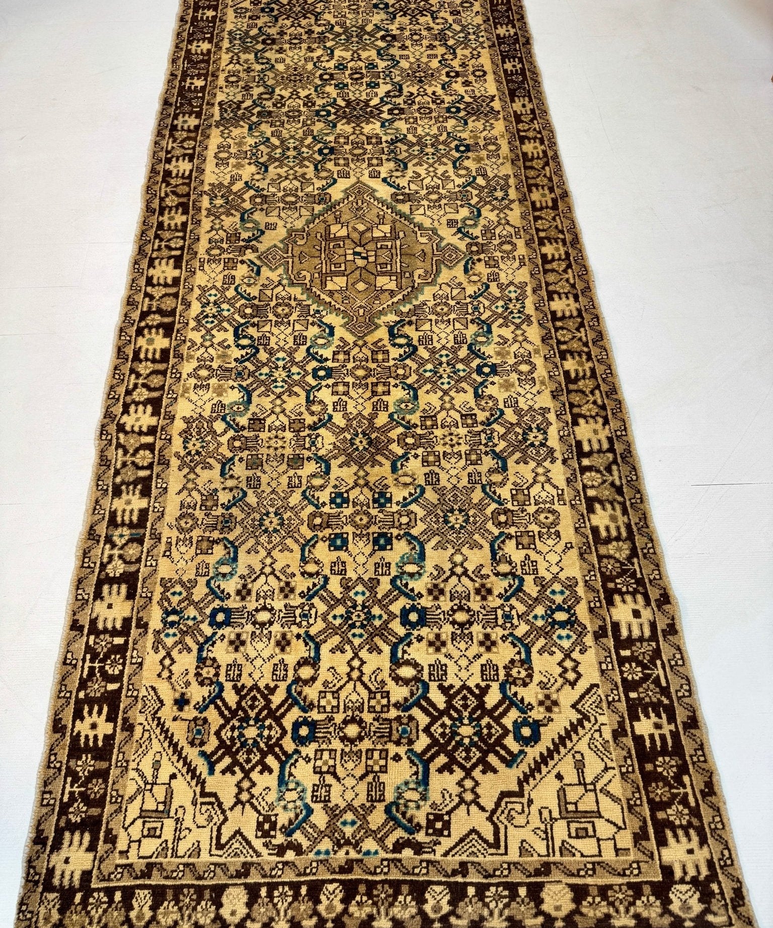 Persian runner rug, beige with blue medallions and dark geometric border