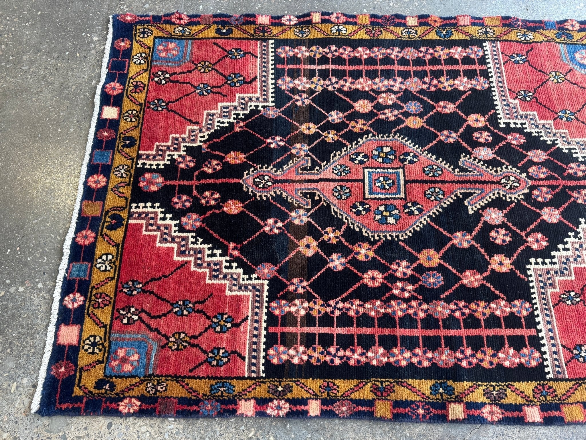 Persian Jozan rug with maroon, navy, and blue geometric medallion and border pattern