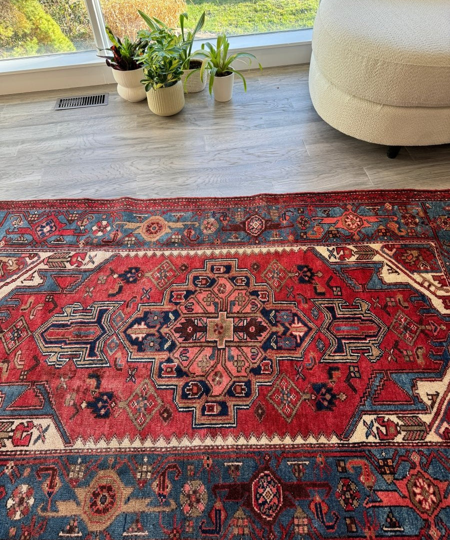 Persian Jozan rug with red field and blue border, centered medallion pattern