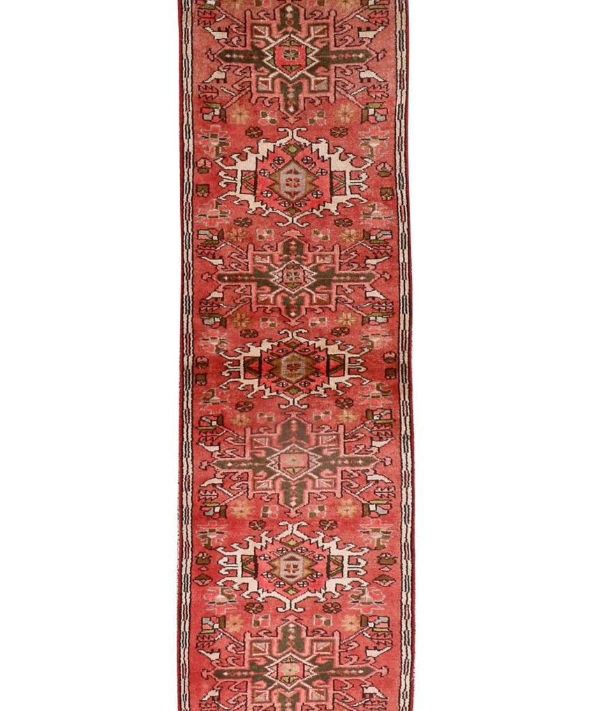 Persian Karaja runner rug with red field and geometric medallion motifs, border trim