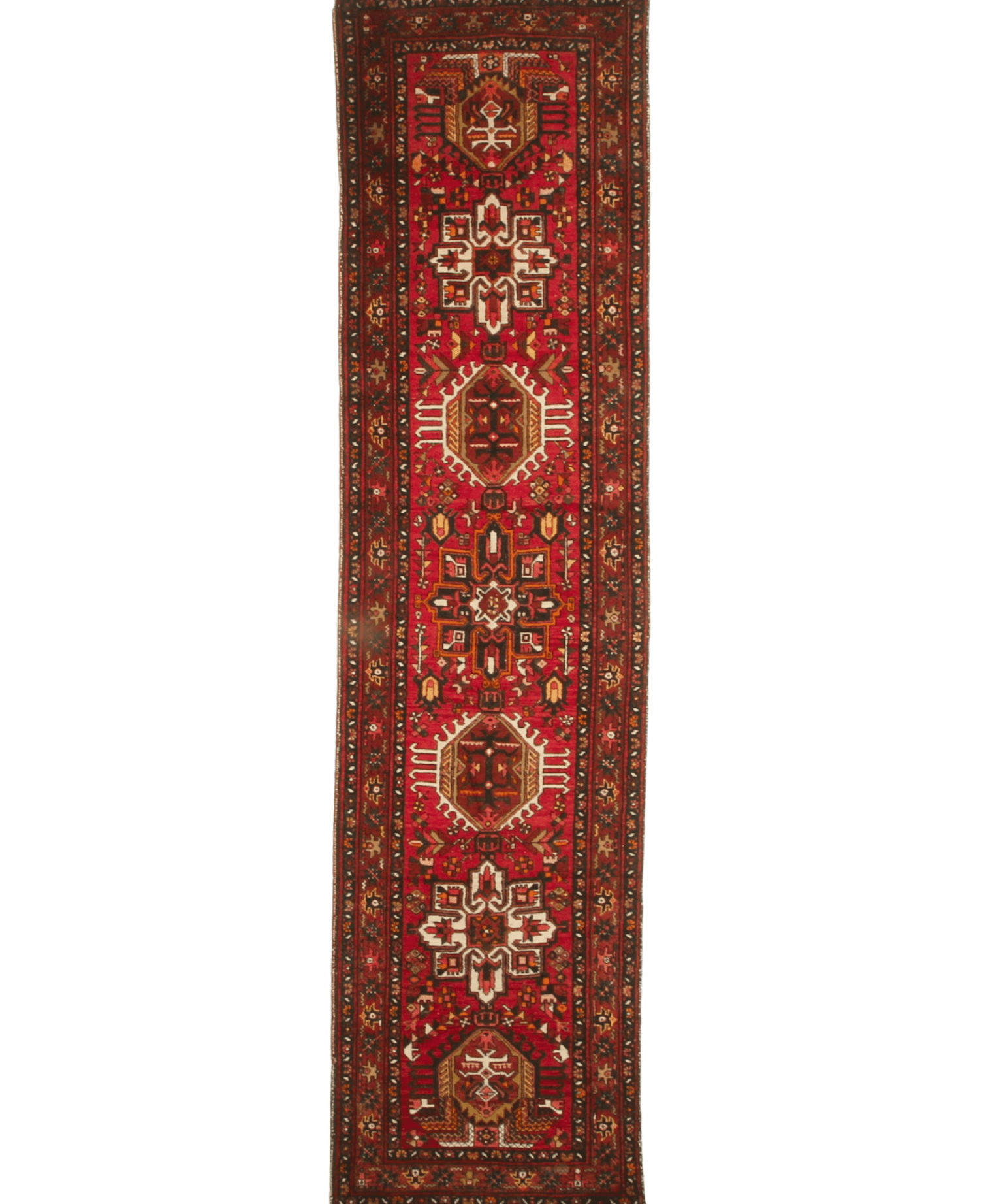 Red runner rug with repeating medallions and detailed central panel