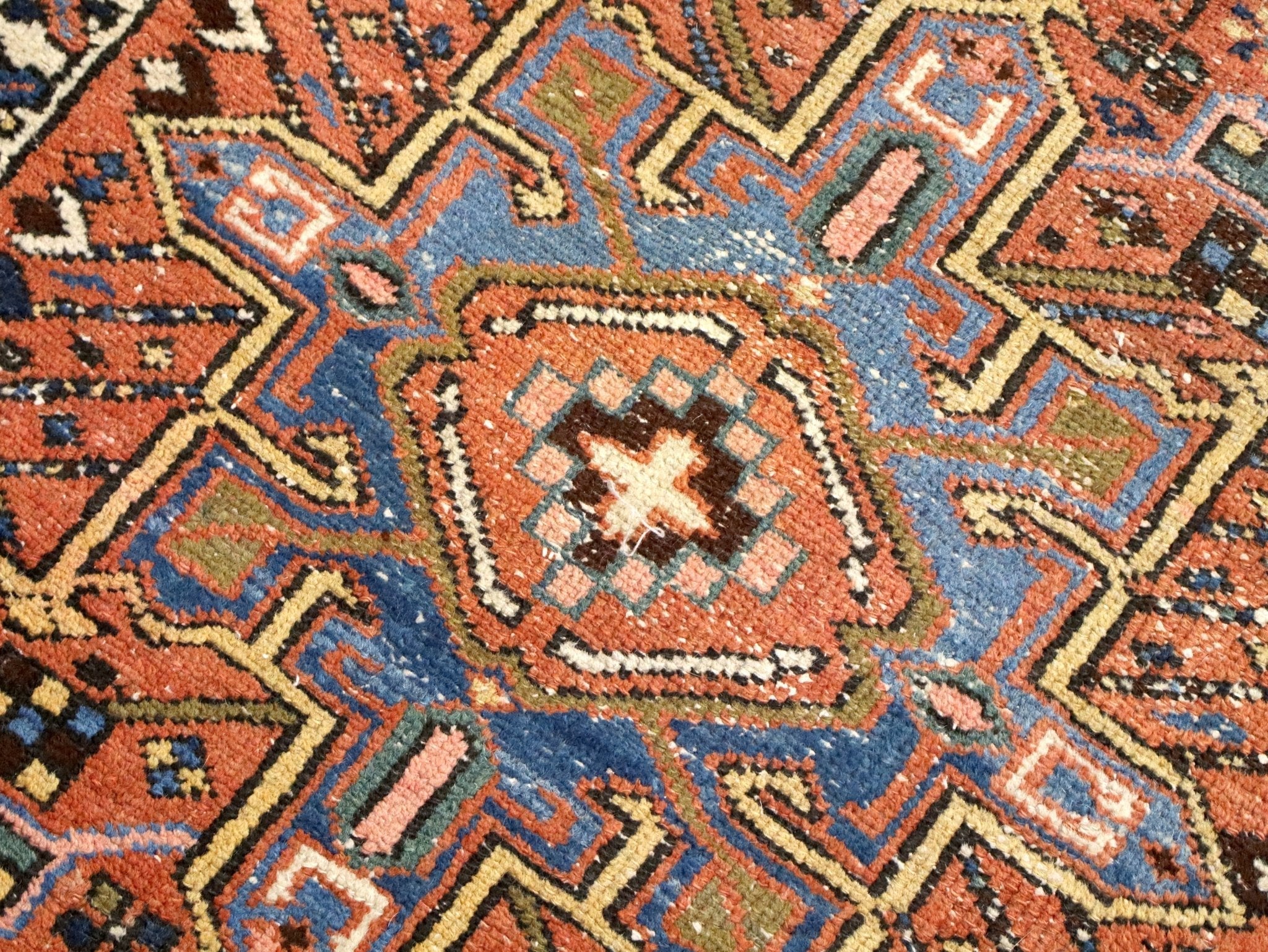 Geometric Persian Karaja runner rug with orange, blue, and cream diamond motifs